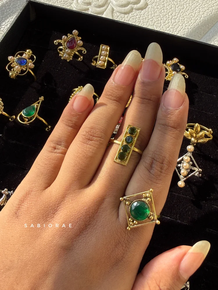 Green Four-Stone Bar Ring